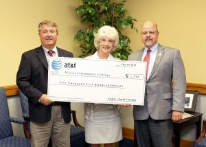 AT&T Regional Director for External Affairs John Lyon presents a check for $2,500 to WCC President Kay Albertson and Wayne County Commissioner Bill Pate (l-r). The money will be used by the Foundation of Wayne Community College to fund scholarships for veterans.