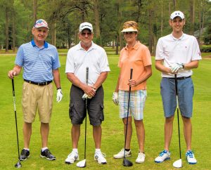 The team with the best net score in the WCC Foundation Scholarship Invitational played at Walnut Creek Country Club was the Woodard Realty team of Mike Woodard, Pat Kennedy, Kathy Woodard, and Michael Woodard (left to right). Their score was 57.