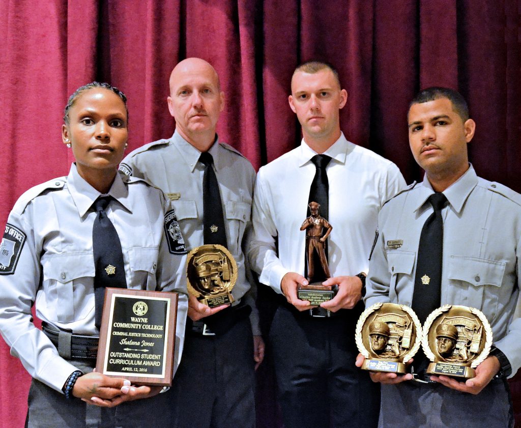 Cadets honored during Wayne Community College's 68th Basic Law Enforcement Training graduation ceremony are Shatana Jones, 2016 Outstanding Student Curriculum Award; Mel Powers, Physical Fitness Award; Andrew Taylor, Valedictorian; Phillip Durham, Top Gun Award and Leadership Award.