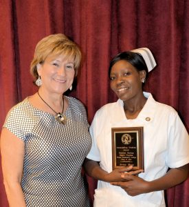 Wayne Community College Nursing Department Chair Sue Beaman presents the 2016 Practical Nursing Outstanding Student Award to Anna Mose.