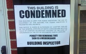 Owners of structures on which signs such as this were posted can repair the buildings.
