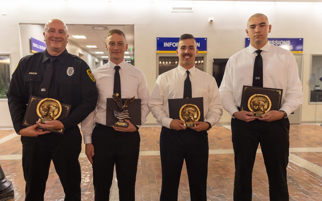 Law enforcement cadets hold awards.