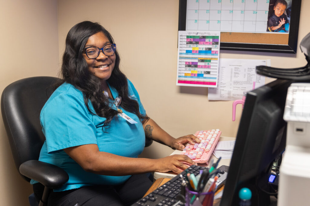 Teara Horton works at her desk.